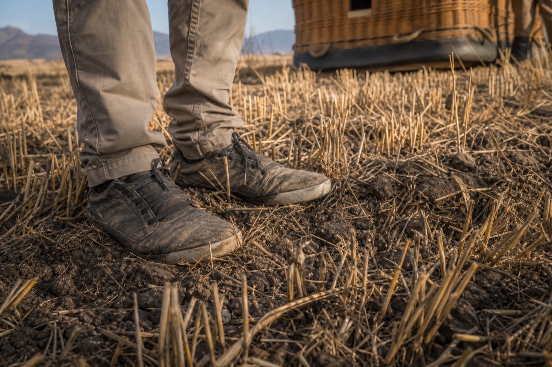 Closed flat shoes standing on the dry stubble of a Teotihuacan landing field